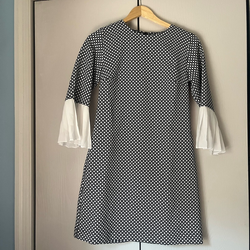 Elegant Black and White Geometric Pattern Dress with Pleated Bell Sleeves